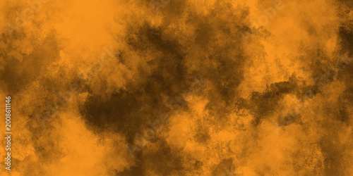 Valokuva Eerie black background with billowing orange smoke on black background