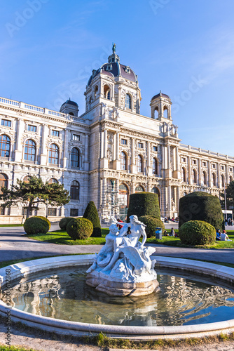 Historic museum building and classical stone fountain in Vienna Austria