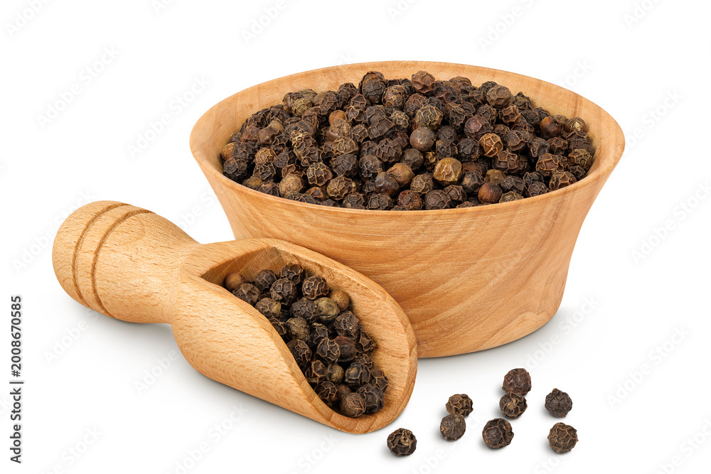 Fototapeta premium Black peppercorns or pepper in a wooden bowl and scoop isolated on a white background