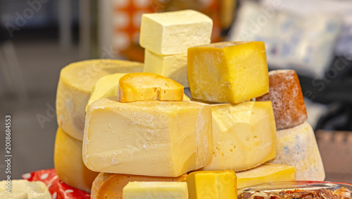 Stack of Aged Hard Cheese Mix Dairy Stall at Farmers Market