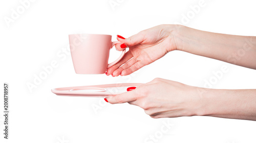 Cup in female hands isolated on white background. Empty cup.
