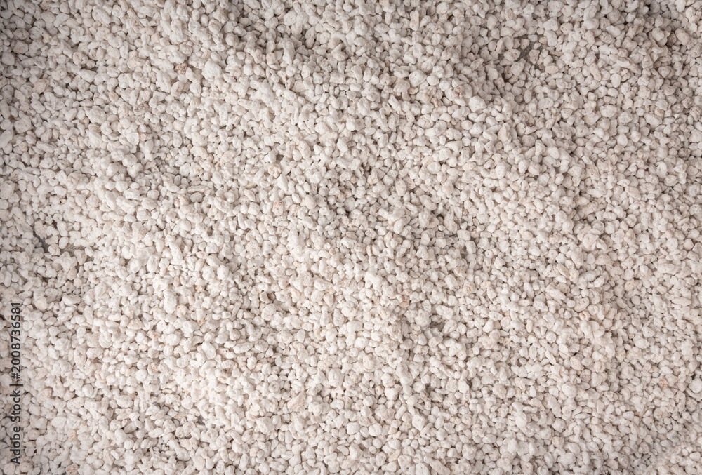 Fototapeta premium Perlite textured background, crushed amorphous volcanic glass close up
