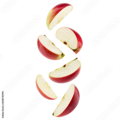 Multiple fresh red apple slices falling downwards isolated on a plain white background, for food isolated on a transparent background