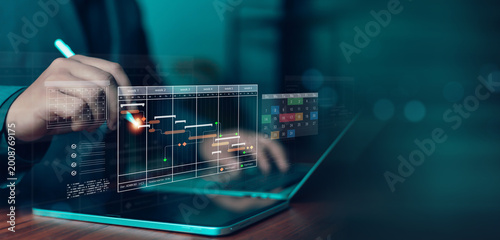 Project management dashboard with digital Gantt chart, timeline scheduling, and task tracking interface on laptop. Business planning, workflow optimization, productivity analytics, and modern project