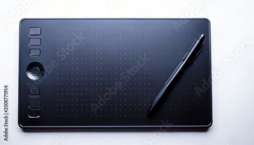 Black graphics tablet with pen on white background, top view.