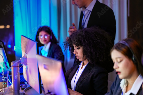 Canvastavla Successful diverse professionals analyzing real-time metrics and software solutions