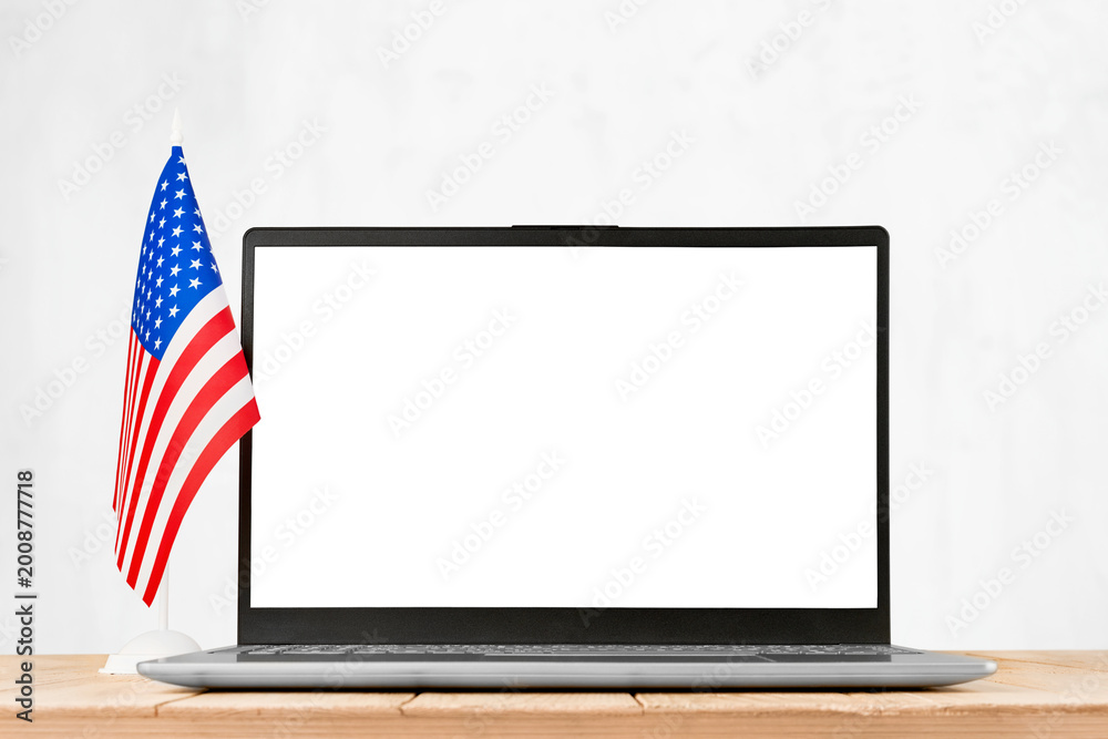 Carta da parati Laptop computer with blank screen and American flag isolated on white background