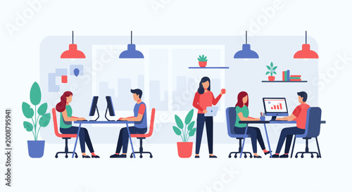 Diverse team collaborating and working on computers in a modern office setting