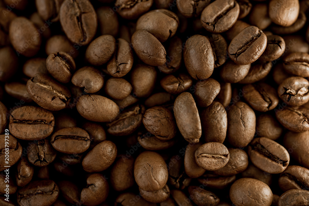 Fototapeta premium Close-up of roasted coffee beans with rich aroma, showcasing espresso and caffeine concept, highlighting texture, freshness, energy, and modern café lifestyle.