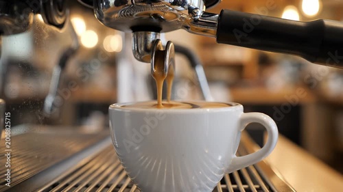 Cappuccino pouring milk foam into white cup on rustic wooden table coffee latte espresso