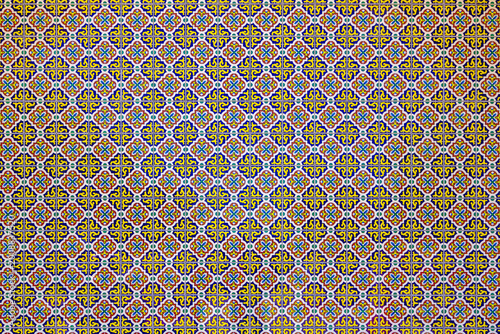 Mexican tile pattern with geometric and floral ornament in blue, yellow, red and white. Mexican Ceramic Mosaic Wall. Mexican ornamental tile background. Seamless Mexican decorative texture for design