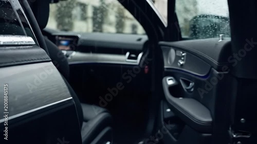 Man pulling a car door closed, transportation lifestyle detail, automotive close-up, modern vehicle use concept, realistic hand and metal texture, clean composition, premium editorial stock appeal,
