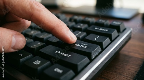 Finger pressing enter key on computer keyboard - submit confirm execute and decision concept made by AI generative