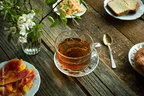 Quadro su tela Spring mood. Tea time. Breakfast with a cup of tea and pastries.