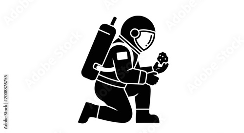 Принти на полотні Astronaut kneels while holding a small rock sample to examine the terrain during a space mission