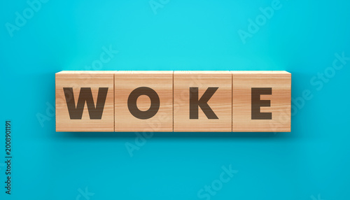Foto WOKE Wooden Block Concept: A close-up shot features a wooden block formation spelling out the word WOKE against a solid blue backdrop