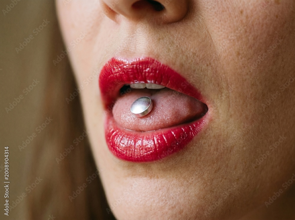 Naklejka premium Hyper-realistic close-up of a glossy pill resting on a tongue for medical advertising.