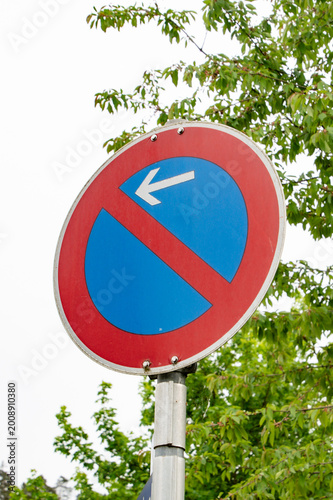 No Parking Traffic Sign with Left Arrow on Street, Restriction Road Symbol