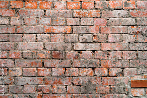 Grunge old and crack red color brick pattern wall textured background.