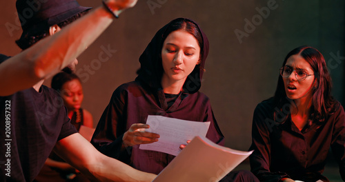 Obraz na plátně Indian young adult gen z male man female group hold script paper read new story