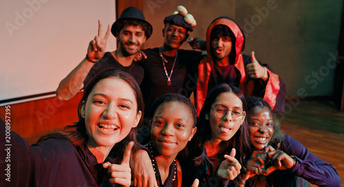 Photography Indian young adult gen z male man female look camera take selfie photos have fun joy hall stage place