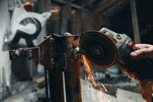 Industrial Metalwork: Sparks Flying from Angle Grinder in Workshop