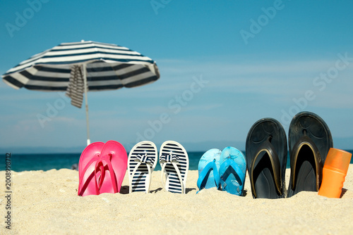 Εκτύπωση καμβά Family slippers on the sand on the beach