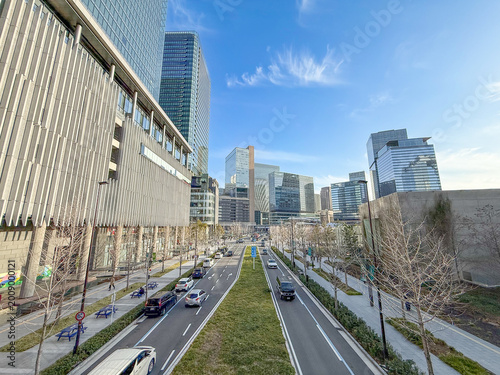 Modern cityscape around Osaka Station with office buildings and blue sky, Osaka Japan