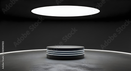 A black cylindrical podium with white stripes on a gray floor with a circular light above
