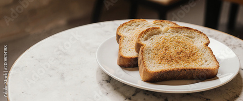 Close up of a toast served on a white plate in a cafe