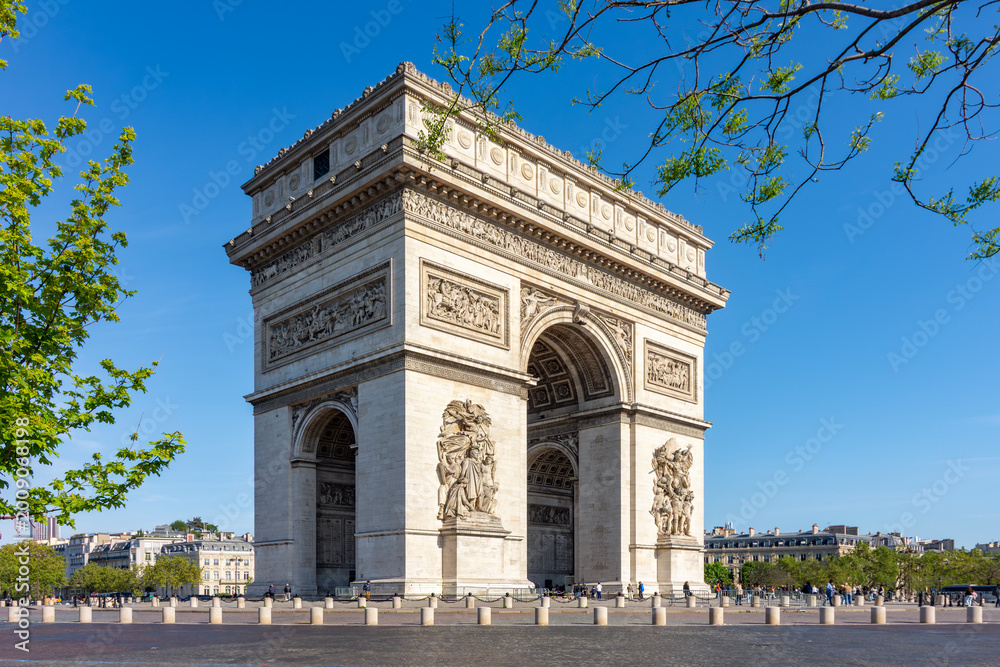 Fototapeta premium Triumphal arch (Arc de Triomphe) on Charles de Gaulle square in Paris, France