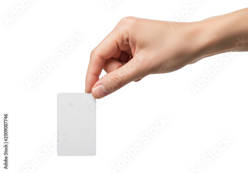 A hand dropping a blank piece of paper into an envelope