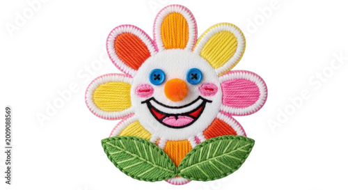 Colorful embroidered flower patch with a happy smiling face isolated on a plain white background