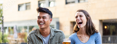 Quadro em tela Horizontal banner or header with multiracial friends drinking beer at brewery pu