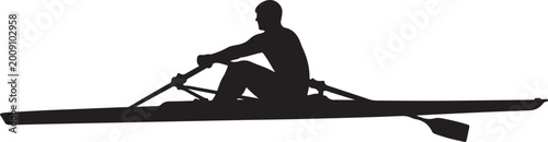 Silhouette of a single sculler rowing a racing boat