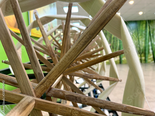 Foto Close up of bamboo silk machine refinery of silk production, made of wooden straws to spin raw silk threads and process the thread by weaving technique