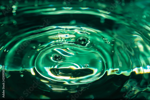 293.Vibrant emerald green water ripple and bubble