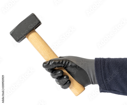 Foto Hand in protective glove holding a sledgehammer isolated on white background rea