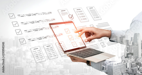 Fotografía A person hand interacts with a laptop displaying digital checklists, set against an urban backdrop, illustrating modern online business and productivity concepts