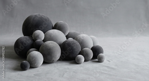 Abstract organic background of soft matte spheres, minimalist 3D geometric composition with elegant studio lighting in grey tones