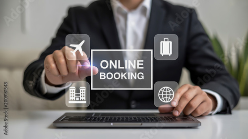 A professional business photo of an online booking interface on a black laptop screen.