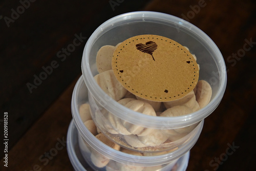 фотографія stack of butter cookies in plastic containers, homemade sequilhos biscuits in tr