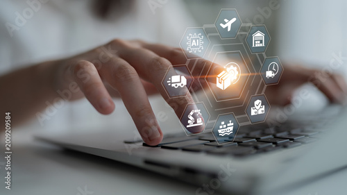 A hand engages with digital icons representing the logistics and transportation sectors, highlighting the integration of technology and innovation in management processes. Ledger