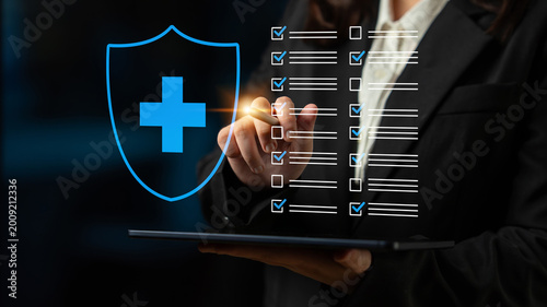 Bilde på lerret A business professional reviews a healthcare checklist on a digital tablet, symbolizing the importance of security and compliance in the medical field