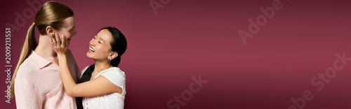 Vászonkép Young couple sharing a joyful moment, embracing love and connection in a warm at