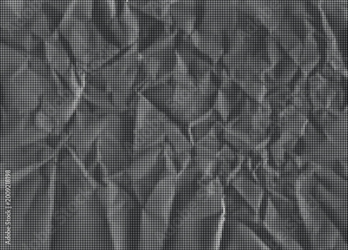 A crumpled sheet of paper with numerous folds and creases fills the frame.