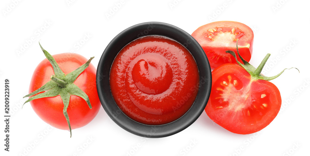 Fototapeta premium Tasty ketchup in bowl and fresh tomatoes isolated on white, top view