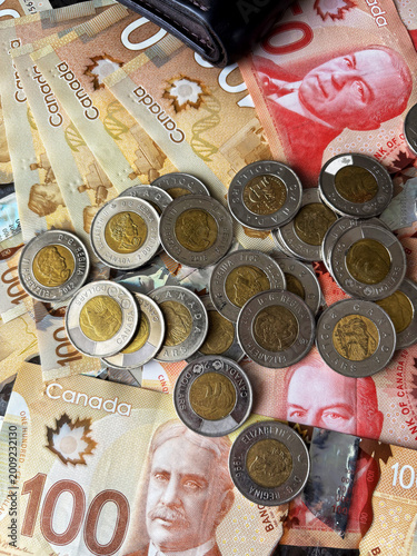 Canadian dollars and coins top view 