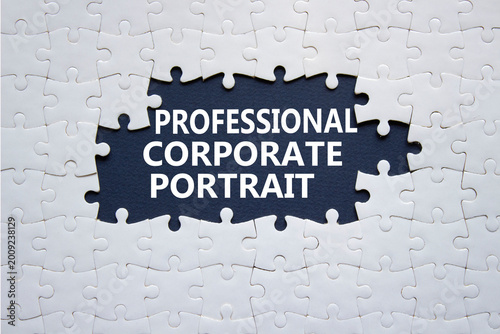 Professional Corporate Portrait symbol. White puzzle with words Professional Corporate Portrait. Beautiful deep blue background. Business concept. Copy space.