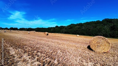 Summer fpv drone flight over a French field with Hay bales.